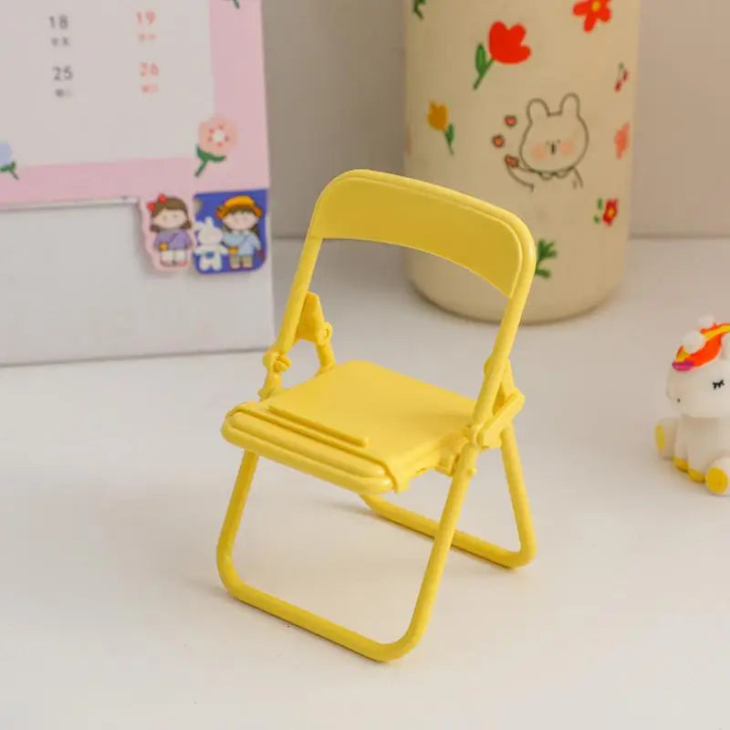 Suporte de Mesa para Celular e Tablet – Mini Cadeira Dobrável e Portátil